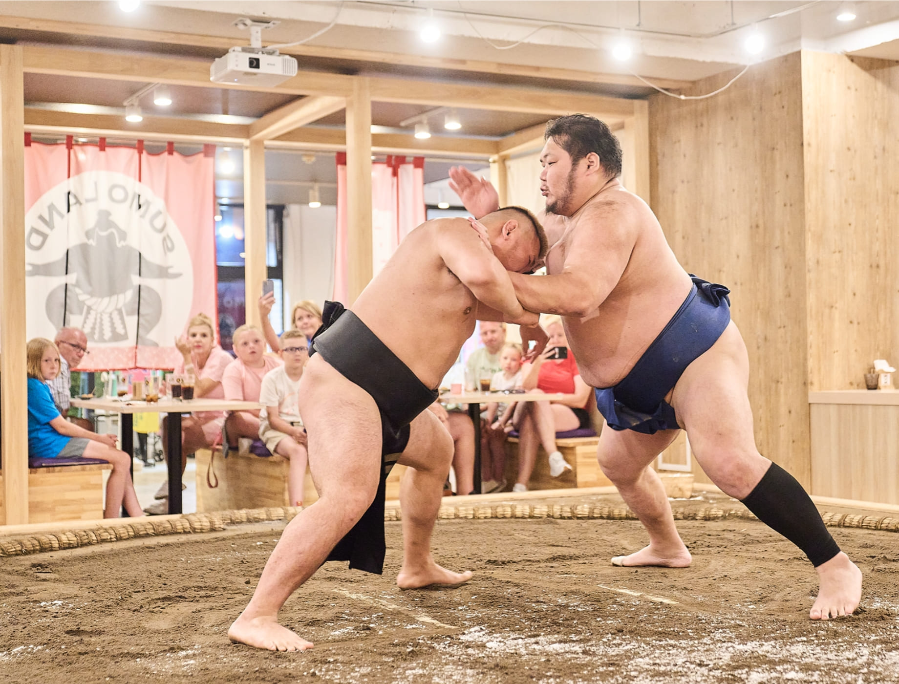 Sumo wrestlers competing in the ring