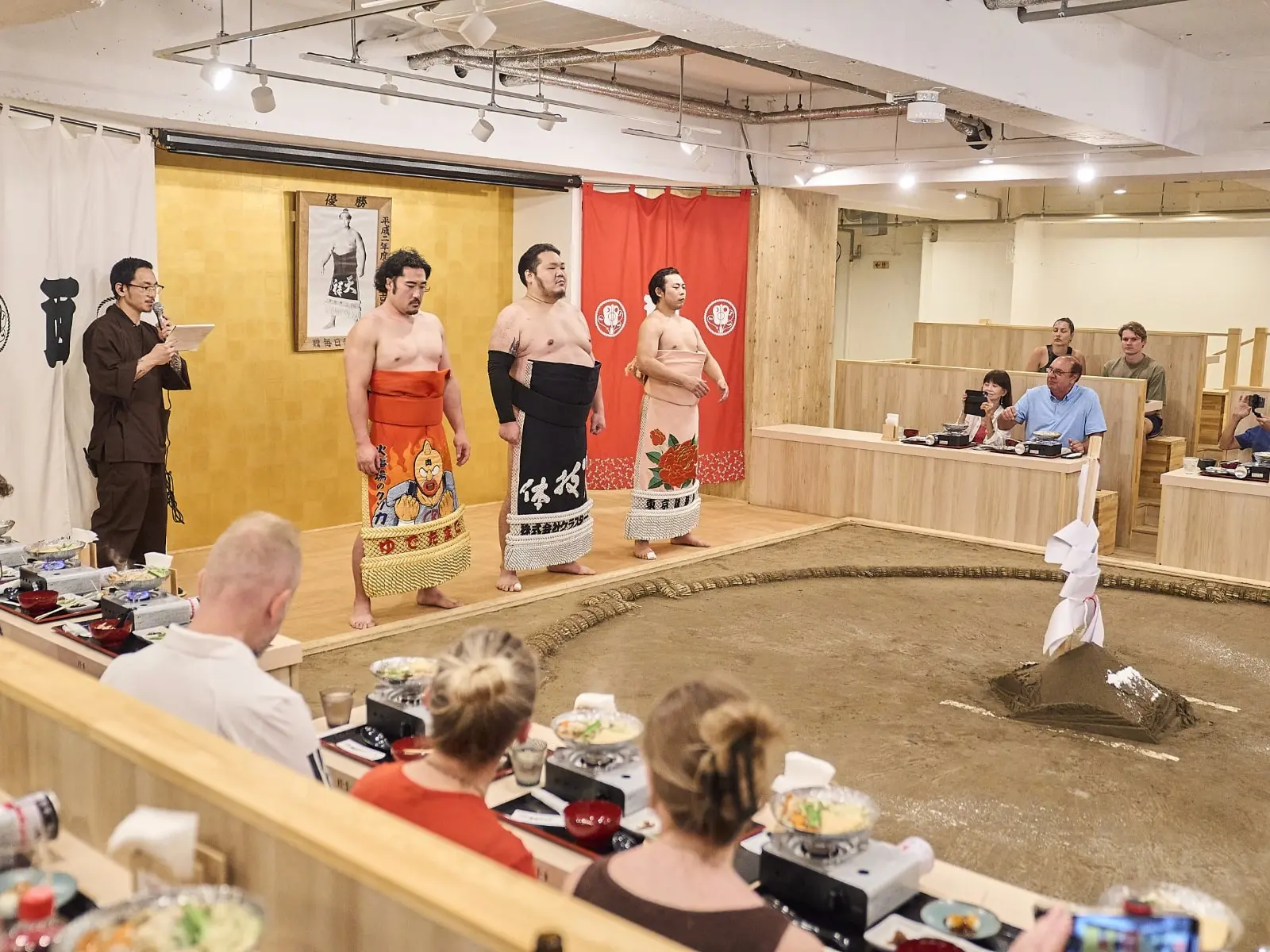 Sumo wrestlers demonstrating a bout for guests