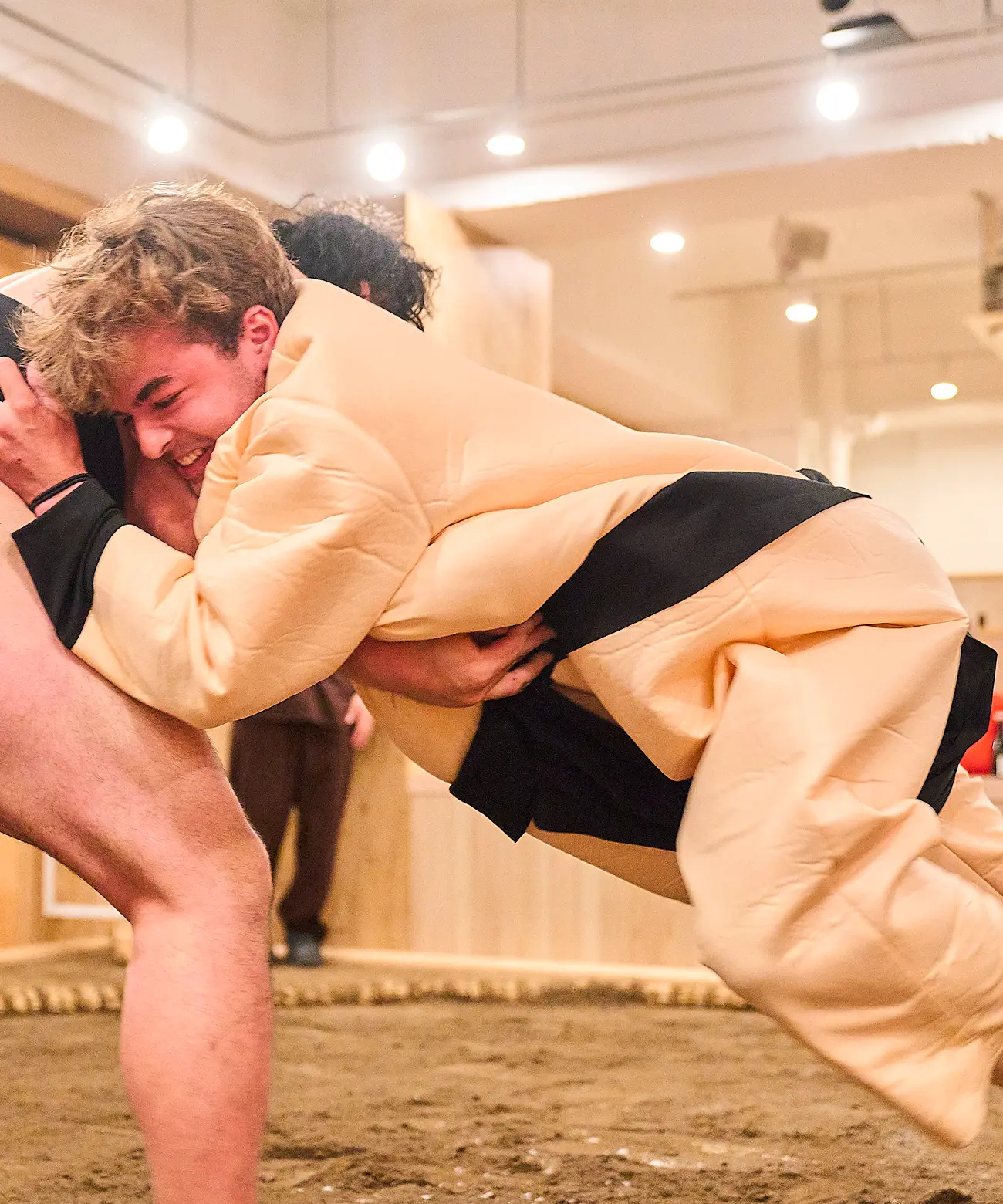 Sumo wrestler and guests during a sumo experience