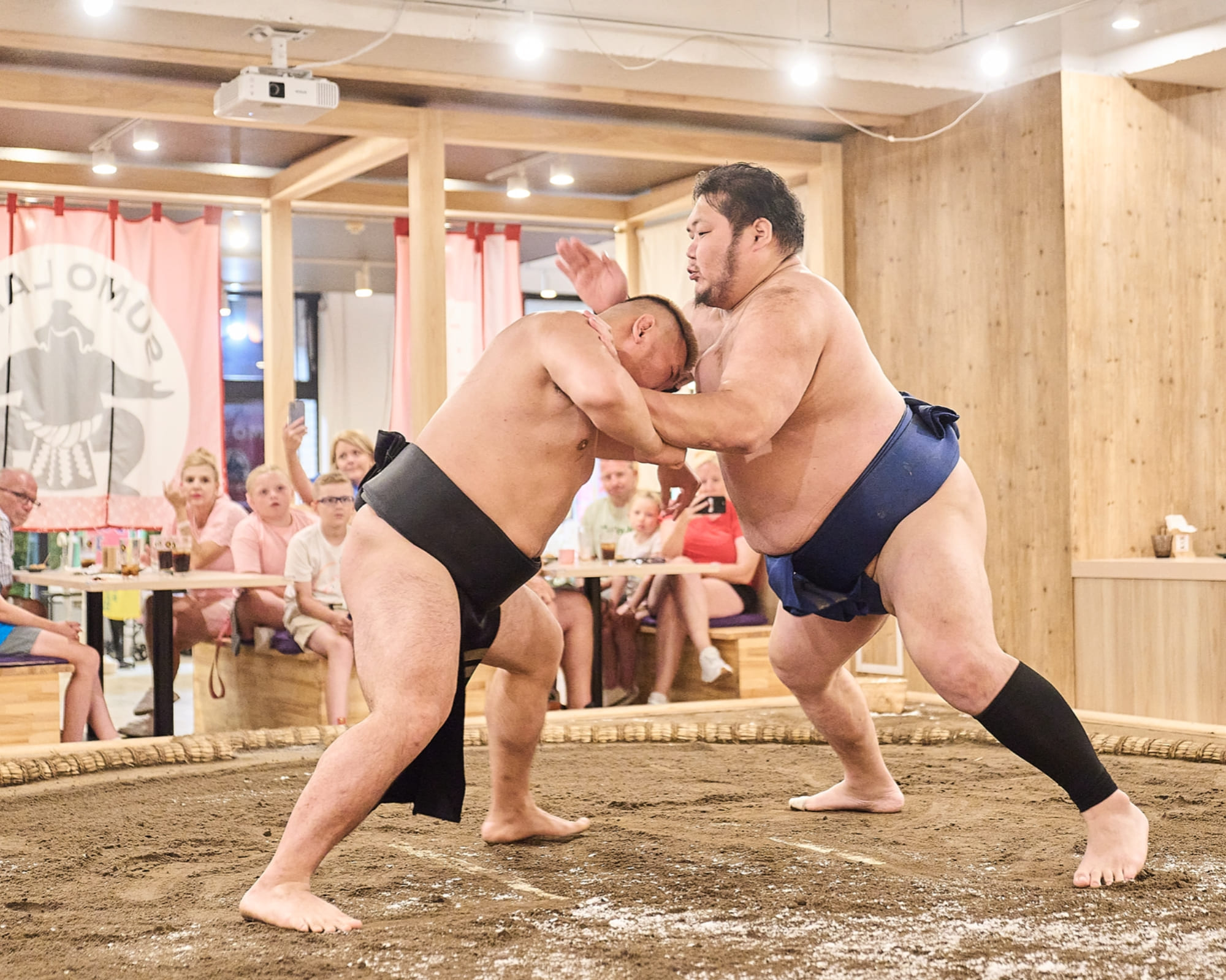 Sumo wrestlers competing in the ring
